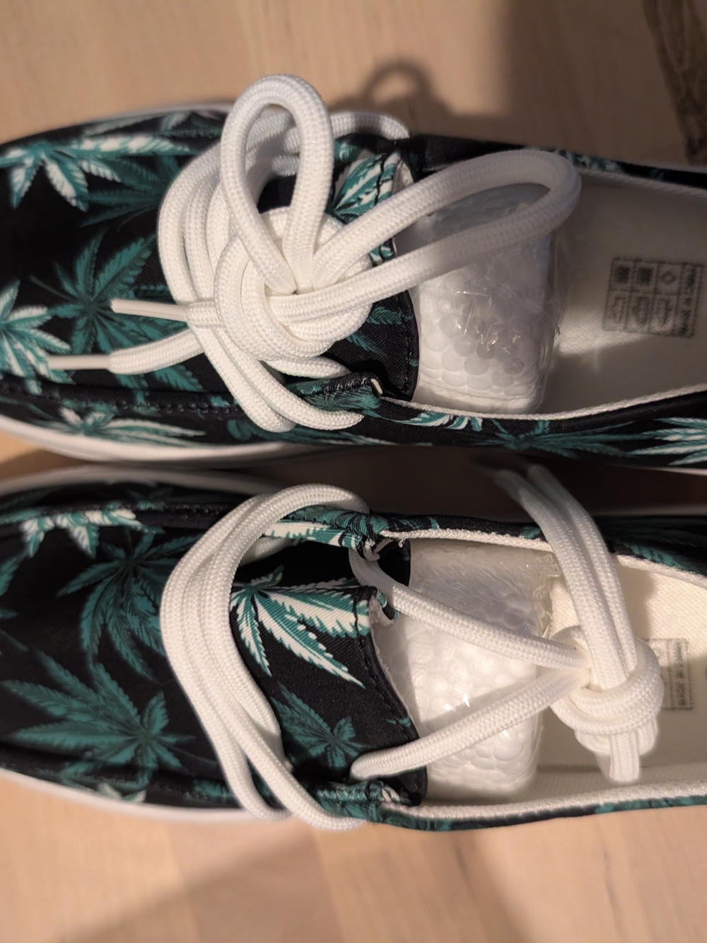 Women's Black Slip-On Sneakers with Green Leaf Print and White Laces